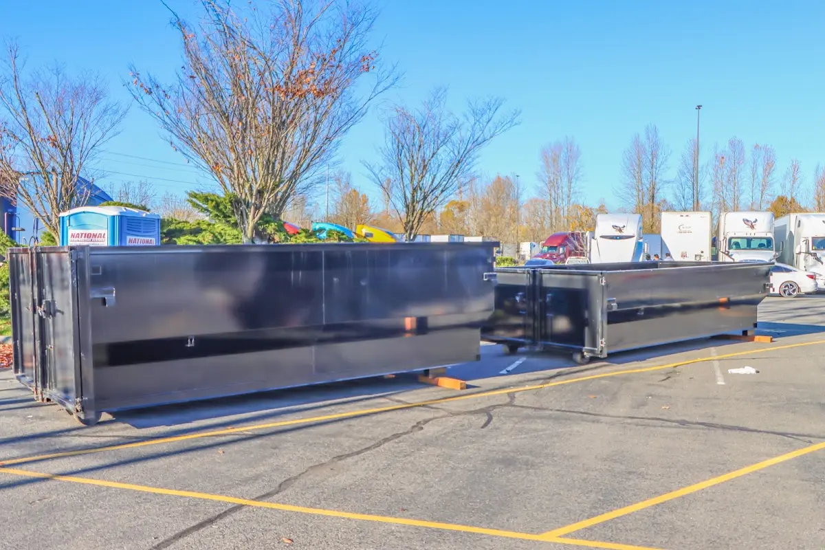 Professional dumpster rental service with roll-off container on residential driveway in Uwchlan